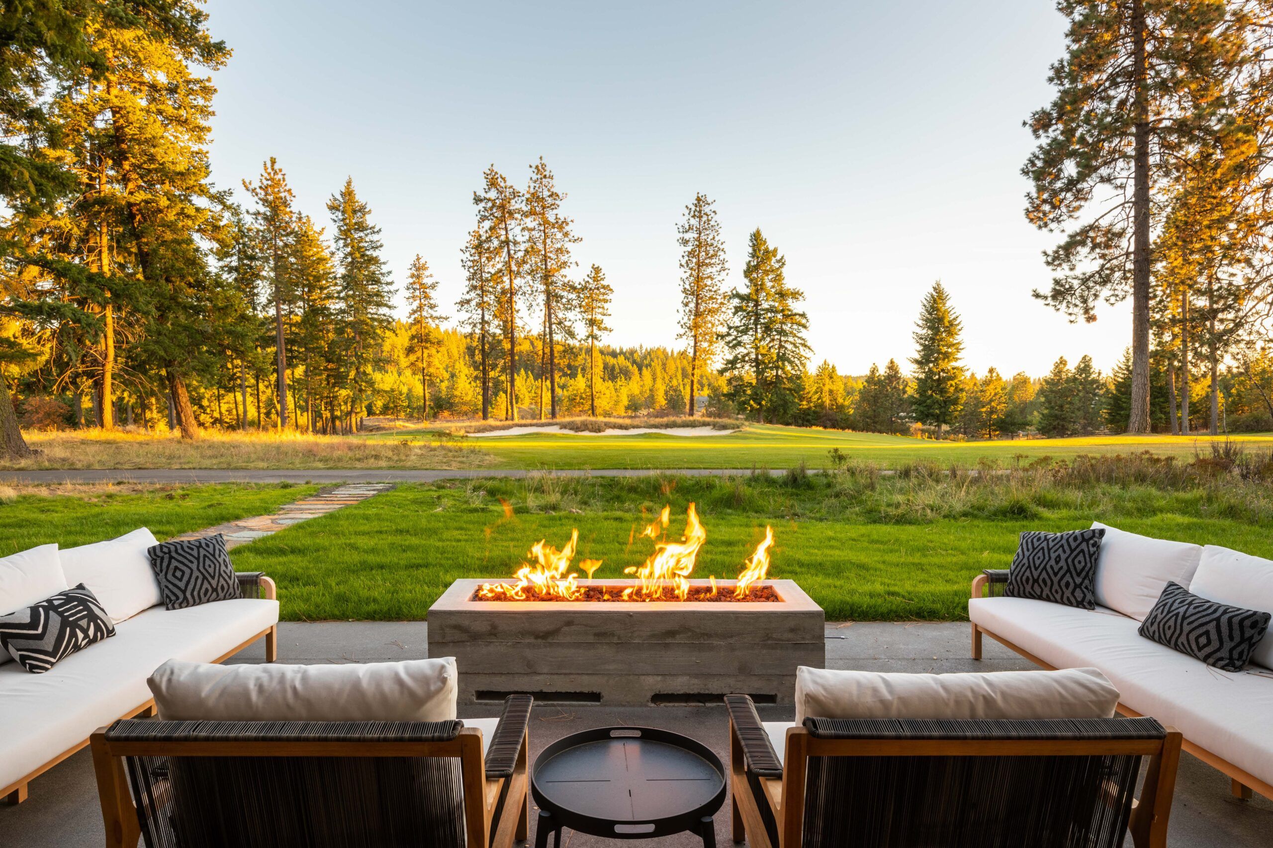 Top Fire Features Spokane: Design & Inspiration for Your Backyard Curious about fire features Spokane homeowners love? From custom fire pits to elegant outdoor fireplaces, there are plenty of options to enhance your backyard. This guide will help you explore the best fire features available in Spokane and how they can transform your outdoor living space. Key Takeaways Spokane offers diverse fire feature options, including custom fire pits and outdoor fireplaces, designed to enhance outdoor living and serve as focal points for relaxation and social gatherings. A successful fire feature project requires meticulous planning, including initial consultations, property surveys, design sketches, and material selection to align with homeowner preferences and local regulations. Copper Creek Landscaping stands out as a leader in landscape design, offering a full-service approach that prioritizes quality, client collaboration, and transforming visions into beautiful outdoor spaces. Exploring Fire Features in Spokane