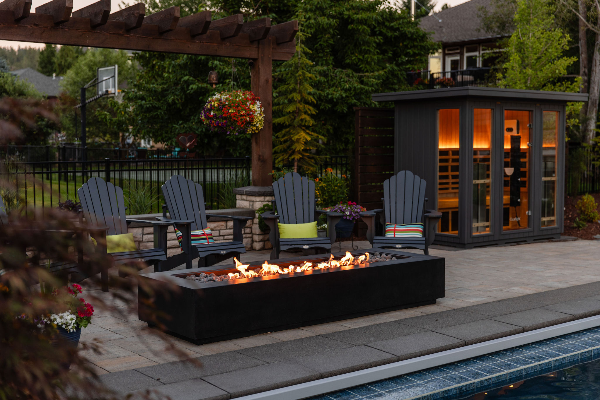 Pool and spa outdoor living space by Copper Creek Landscaping