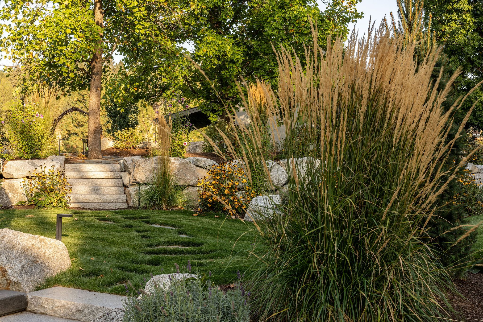 Layered planting and softscape landscape by Copper Creek Landscaping