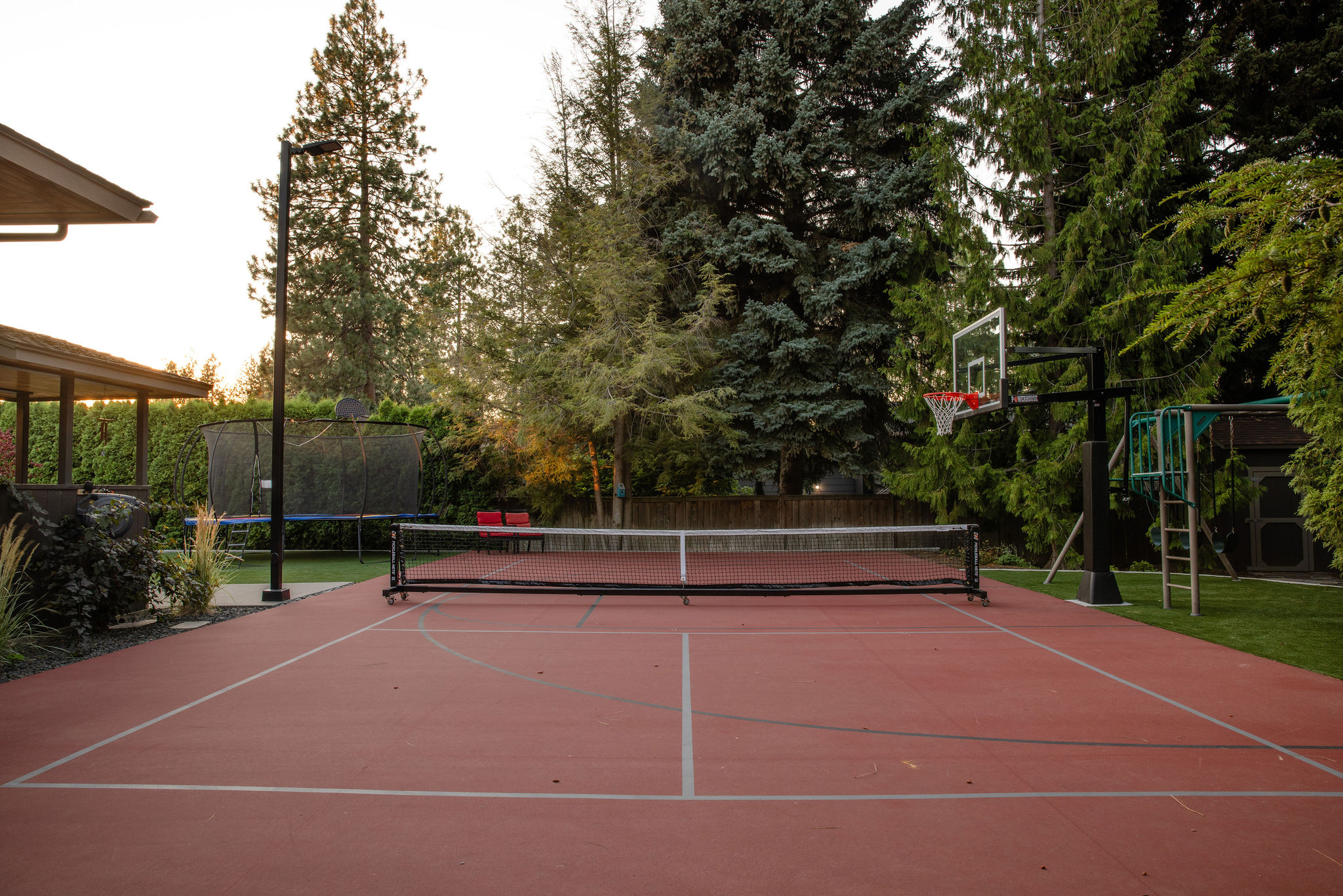 red sports court, half-court basketball and pickleball combo court